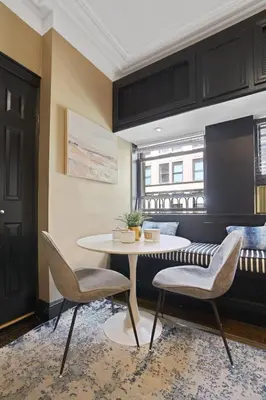 a dining room with a table and two chairs at Mansfield in New York