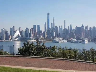 a view of a city with boats in the water at Apart Studio West NY 12Mints From NYCity Times Square in West New York