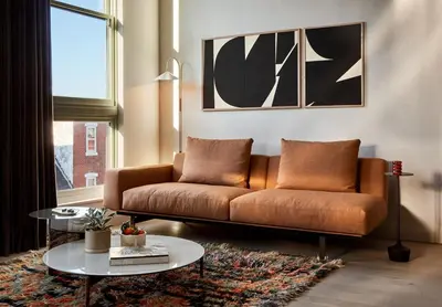 a living room with a couch and a table at Archway Hotel Residence in Philadelphia