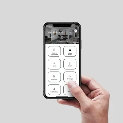 a hand holding a iphone with a white calculator at Archway Hotel Residence in Philadelphia