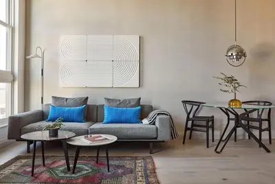 a living room with a couch and a table at Archway Hotel Residence in Philadelphia