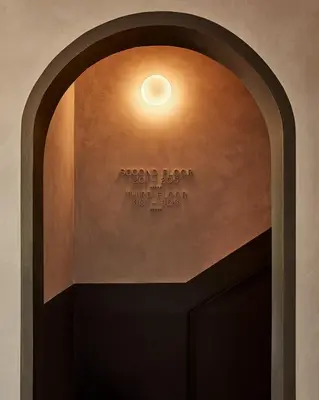 an archway in a building with a light on it at Archway Hotel Residence in Philadelphia