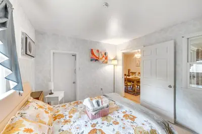 a bedroom with a bed with a basket on it at Movie Room and Home Gym Sinking Spring Home! in Sinking Spring