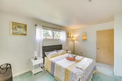 a bedroom with a bed and a window at Movie Room and Home Gym Sinking Spring Home! in Sinking Spring