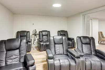 a waiting room with leather chairs and chairs at Movie Room and Home Gym Sinking Spring Home! in Sinking Spring
