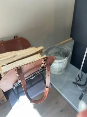 a brown purse sitting on a table next to a basket at Private Cottage with Hot Tub in the Woods in Thompson