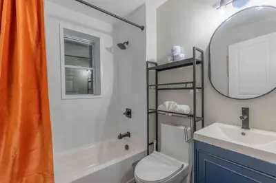 a bathroom with a sink and a toilet and a mirror at 2 Days Stay Get 40 percent OFF for, Sleeps 6 & 2 Queen in Newark