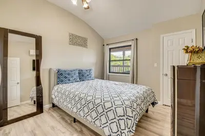 a bedroom with a bed and a window at Modern Harveys Lake Apartment with Beach Access! in Harveys Lake