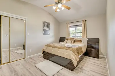 a bedroom with a bed and a ceiling fan at Modern Harveys Lake Apartment with Beach Access! in Harveys Lake