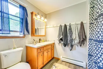 a bathroom with a toilet and a sink at Game Room and Private Yard Family Gem in Kunkletown in Effort