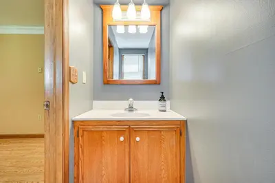a bathroom with a sink and a mirror at Game Room and Private Yard Family Gem in Kunkletown in Effort
