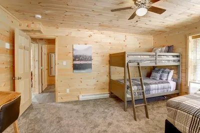 a bedroom with two bunk beds in a log cabin at NEW Construction - 7 Bedroom Log Cabin in Blakeslee