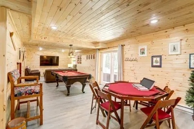 a room with a ping pong table and a pool table at NEW Construction - 7 Bedroom Log Cabin in Blakeslee