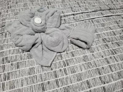 a teddy bear made out of a flower on a couch at Comfortable in Roselle
