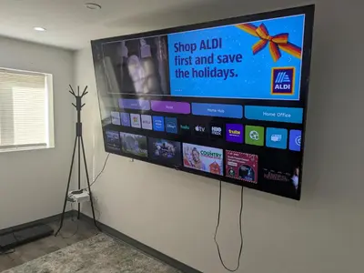 a flat screen tv hanging on a wall at Jetted Tub Stay in Passaic
