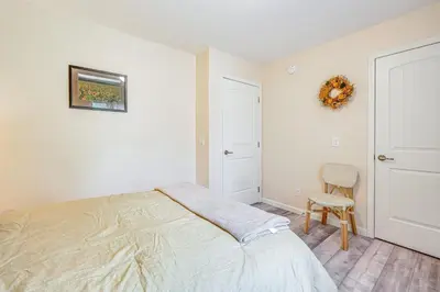 a bedroom with a bed and a chair at Comfortable Muncy Home with Serene Views! in Muncy