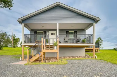 a house with a large porch and a deck at Comfortable Muncy Home with Serene Views! in Muncy