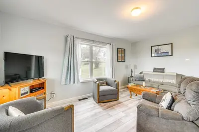 a living room with a couch and a tv at Comfortable Muncy Home with Serene Views! in Muncy