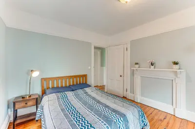 a bedroom with a bed and a fireplace at Walk to Hudson River Pet-Friendly Home with Views! in Newburgh