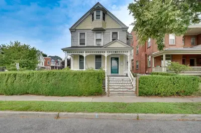 a house with a gate in front of it at Walk to Hudson River Pet-Friendly Home with Views! in Newburgh