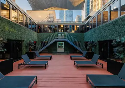a building with chairs and stairs in the middle at Hudson Yards Hotel in New York