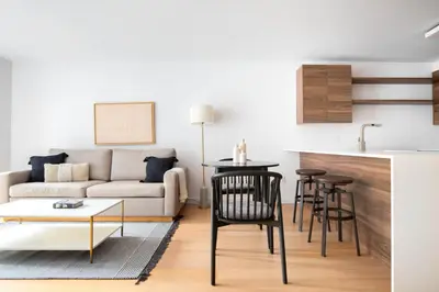 a living room with a couch and a table at LES 1br w gym doorman wd nr park NYC-1314 in New York