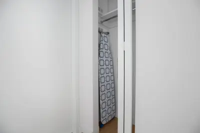 a closet with a blue and white tie in it at LES 1br w gym doorman wd nr park NYC-1314 in New York