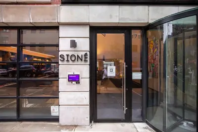 a store front with a door with a sign that reads slower at LES 1br w gym doorman wd nr park NYC-1314 in New York