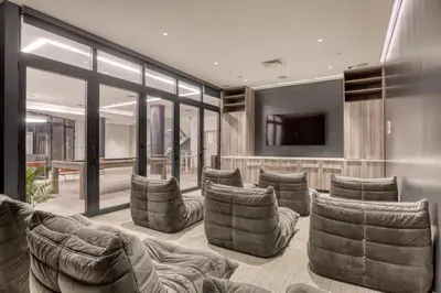 a living room with couches and a flat screen tv at LES 1br w gym doorman wd nr park NYC-1314 in New York