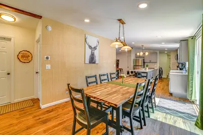 a dining room and kitchen with a table and chairs at Nature Escape in Unadilla Modern Home with 2 Decks in Unadilla