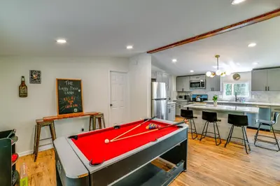 a room with a pool table in a kitchen at Nature Escape in Unadilla Modern Home with 2 Decks in Unadilla