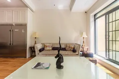 a living room with a statue on a table at Little manhattan near Time Square in New York