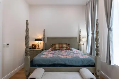 a bedroom with a bed and a window at Little manhattan near Time Square in New York
