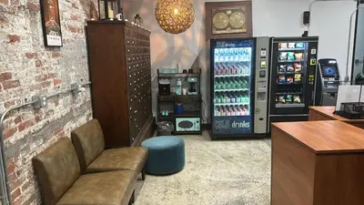 a shop with a drink cooler in a store at Tribeca Hotel FiDi in New York