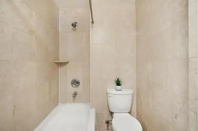 a bathroom with a toilet with a plant on top of it at 73-310 Newly Reno Studio UWS Doorman Gym Laundry in New York