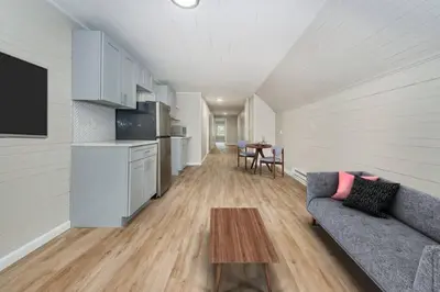 a living room with a couch and a table at Perfect Private Unit in Passaic in Passaic