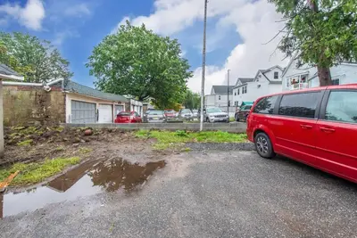 a red van parked in the driveway of a house at Perfect Private Unit in Passaic in Passaic