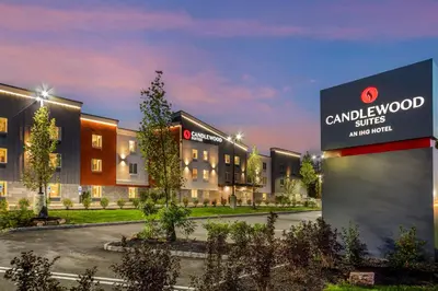 a rendering of the condos at night at Candlewood Suites Lawrenceville - Princeton by IHG in Lawrenceville