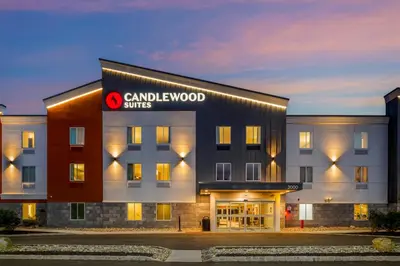 a building with a sign on the side of it at Candlewood Suites Lawrenceville - Princeton by IHG in Lawrenceville
