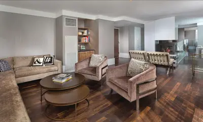 a living room with a couch and chairs and a table at Beautiful Resort in Midtown 45 - Deluxe 1BD in New York