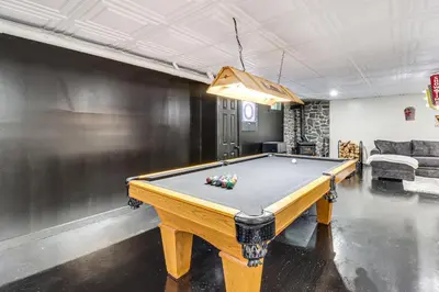 a pool table in the middle of a room at 7 Mi to Big Boulder Resort-Style Poconos Retreat in Albrightsville