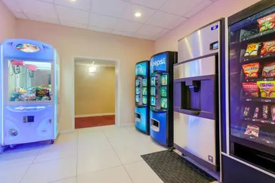 a room with two video game machines in a store at BEST WESTERN PLUS Poconos in Tannersville