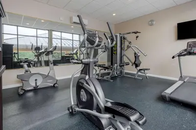 a gym with several exercise bikes in a room at BEST WESTERN PLUS Poconos in Tannersville