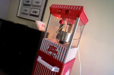 a red blender sitting on top of a counter at Newark Gem Ruby 3BR, 3BA - Sleeps 14 - Walk to Prudential Center and Newark Penn Station, Near EWR and American Dream Mall, includes Parking - WiFi - Laundry - Backyard - Gym in Newark