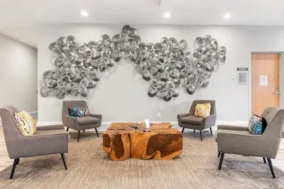 a room with a table and chairs and a bunch of balloons at Luxury 1BR - Glass Wall & Window in Philadelphia