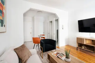 a living room with a white couch and a table at 444-3A Newly renovated 1BR - Elevator Building in New York