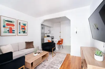 a living room with a couch and a table at 444-3A Newly renovated 1BR - Elevator Building in New York