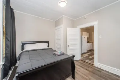 a bedroom with a large bed in a room at Happiness in Harrison in Harrison