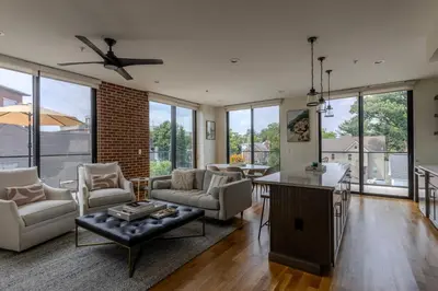 a living room with a couch and a table at Downtown Princeton Chic in Princeton