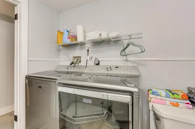 a kitchen with a stove and a sink at Walk to Mohican Lake Catskills Getaway with Dock! in Glen Spey